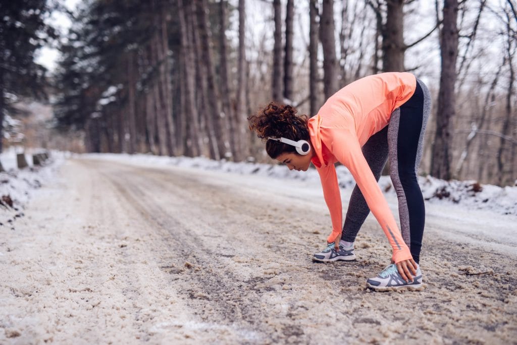 Young adult working out in the winter.