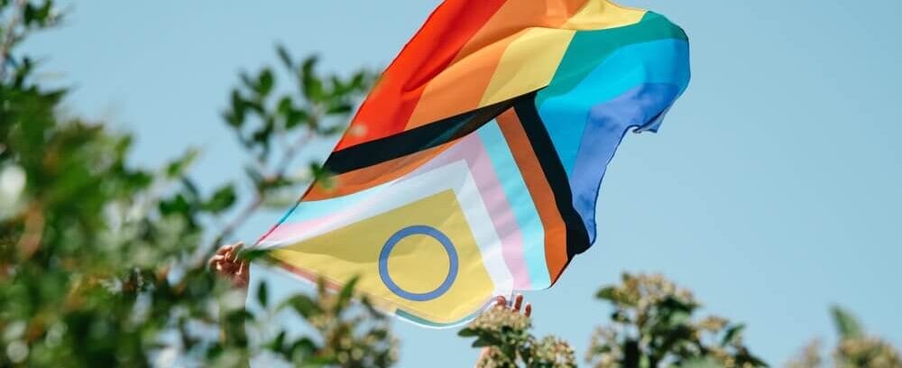 LGTBQ+ flag is displayed at an event