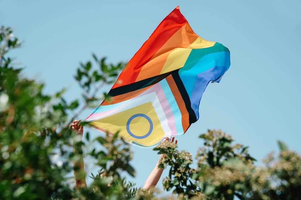 LGTBQ+ flag is displayed at an event