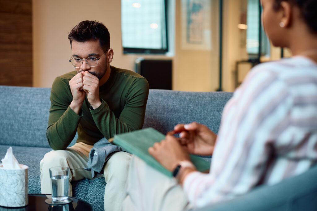 Young adult sitting in an individual therapy session.