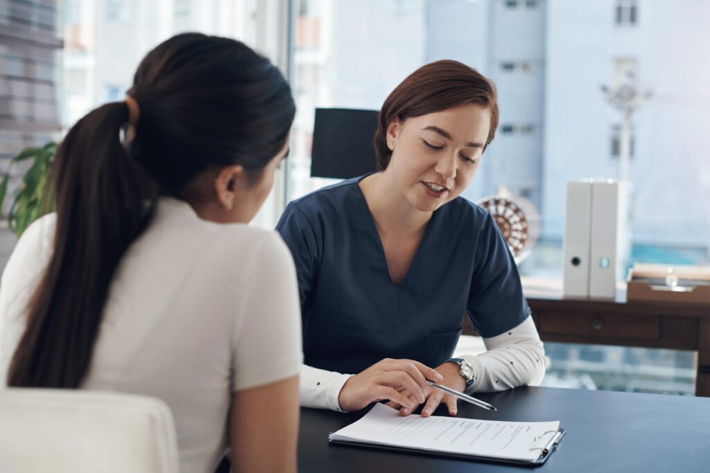Mental health professional helping young adult.