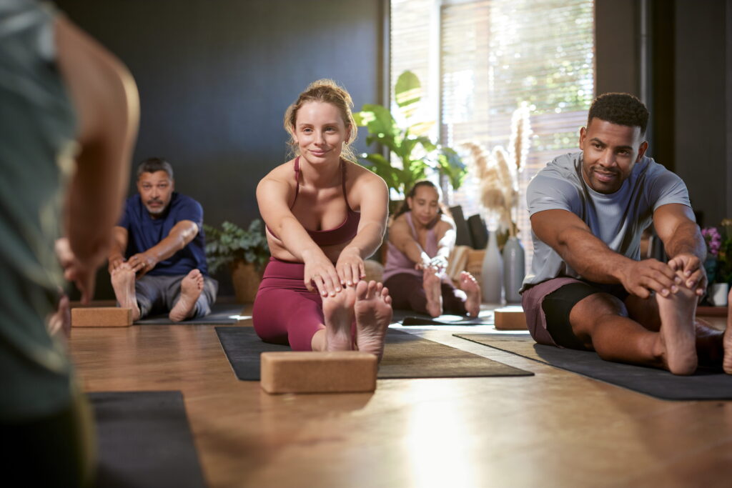 Woman participating in a yoga class.