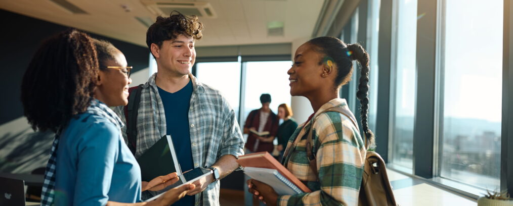 College students talking together after class.