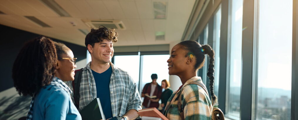 College students talking together after class.
