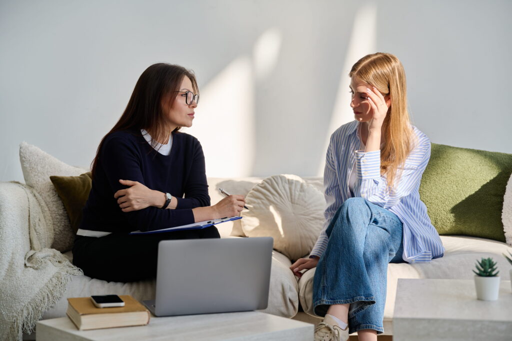 Young adult talking to a mental health professional.