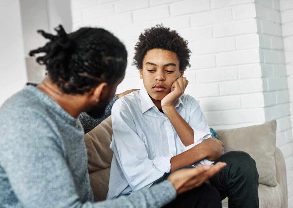 Father talking to his son.