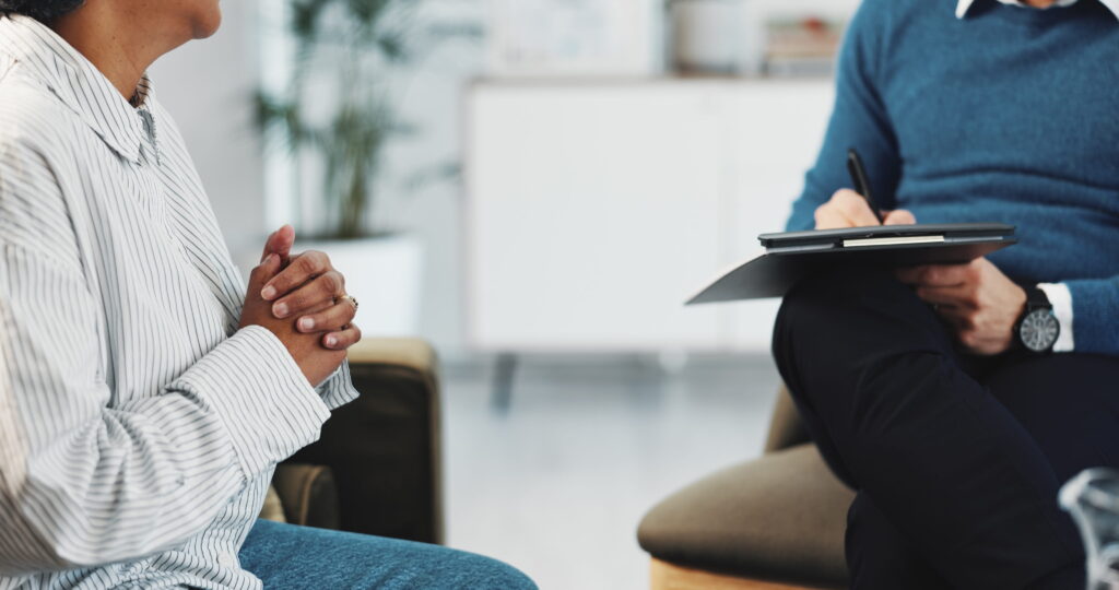 Young adult meeting with a mental health professional.