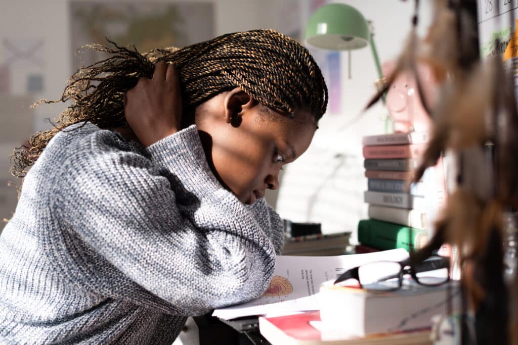 Young student studying at her desk.